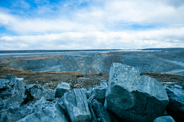 Open pit mining work of excavators and dump trucks