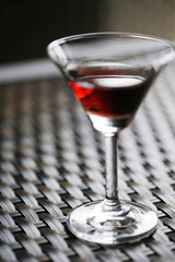 A glass of drink on the table