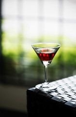 A glass of drink on the table
