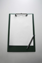 Clipboard with paper and pen