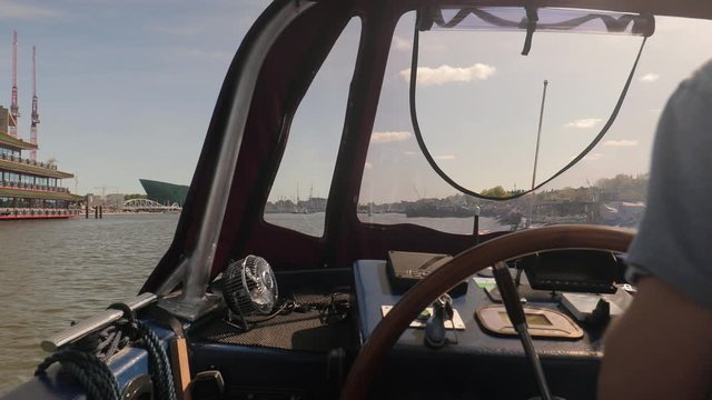 Leisure boat ride in Amsterdam, sunny weather