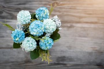 Fake flowers in a vase on the table