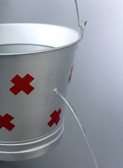 Water leaking from a pail © ImageHit