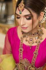 Fototapeta premium Asian Bride makeup shoot, Bridal campaign shoot. Lahore Pakistan. 31 July 2019.