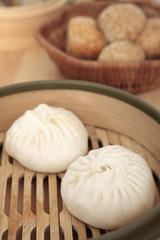 Chinese steamed buns in bamboo steamer