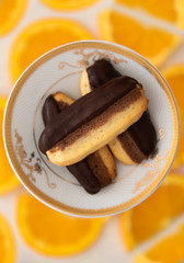 close up of orange and chocolate biscuits 