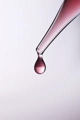 Pipette with drop of liquid