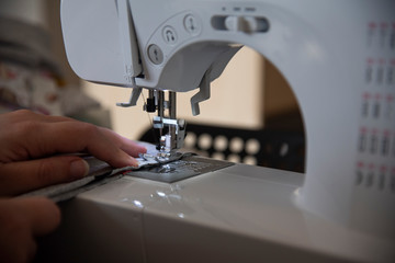 Sewing machine with grey fabric 