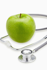Green apple and a stethoscope