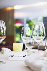 Restaurant table setting with reserved sign