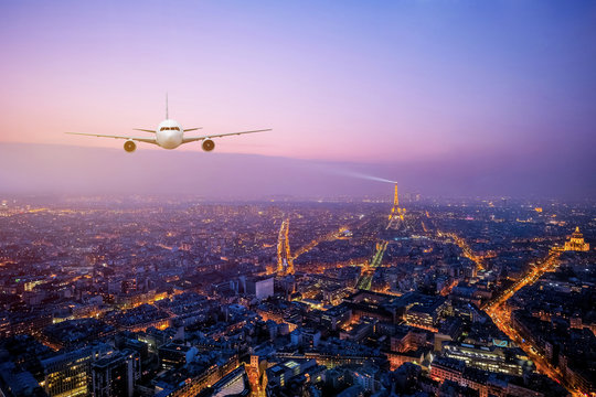 Real airplane over the Cityscpae with the view of Eiffel Tower Paris, France