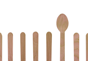 Wooden spoon in wood row on white background , difference concept