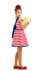 Little girl with sea shell.he concept of a family vacation.