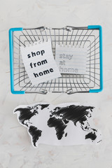 helping businesses after the global lockdown, shopping bags and world map with Shop from home and Stay Home message