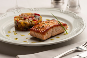 Baked fried salmon with vegetables ratatouille.