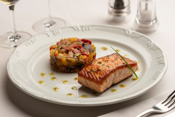 Baked fried salmon with vegetables ratatouille.