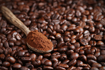 Roasted coffee beans and wooden spoon