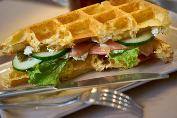 Brussels waffles with smoked salmon and salad.