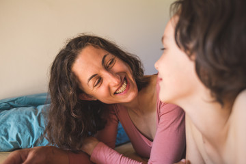 A woman spends time with her child at home.