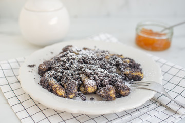 Potato dumplings sulance gnocci with milled poppy seeds and sugar powder