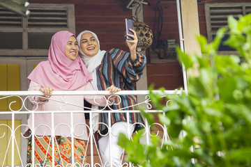 Fototapeta na wymiar Mother and daughter taking a selfie