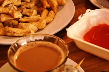 Grilled fish cake parcels from Jakarta. Otak otak food. Served with two kinds of spicy sauces