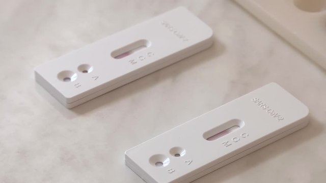 Lab card kit tested positive for viral novel coronavirus sars-cov-2 virus. Rapid COVID-19 test for detection of specific antibodies IgM and IgG to novel corona virus SARS-CoV-2.
