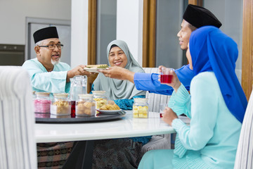 Fototapeta na wymiar Muslim family feasting during the Eid celebration