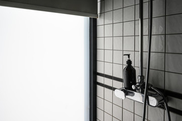 View of beautiful  modern bathroom  style with black soap bottle.