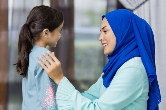 Muslim girl and her mother during Eid al-Fitr