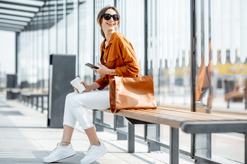 Woman at the transport stop