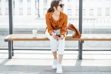 Woman at the public transport stop