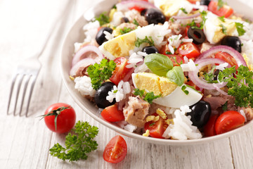 mixed vegetable salad with rice, egg, onion, tomato and olive