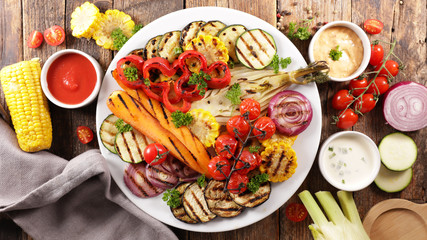 grilled colorful vegetables, aubergine, zucchini, bell pepper, celery, onion, corn with basil