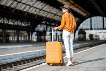 Fototapeta premium Woman at the old train station