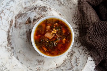 Russian borscht with sorrel and fresh garlic knots pamopushkas. hot soup with egg version. Sorrel soup. 