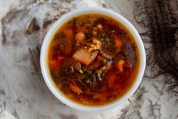 Russian borscht with sorrel and fresh garlic knots pamopushkas. hot soup with egg version. Sorrel soup. 