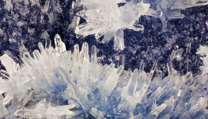 Fototapeta na wymiar white small crystals on dark blue background