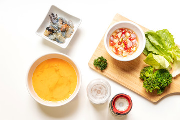 Omelette ingredients for creamy omelette with shrimps on rice served fish sauce with Thai chilis (Thai condiment “Prik Nam Pla”). Delicious and easy menu.  