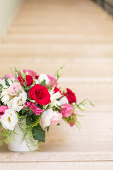 Bunch of flowers in reusable vase. Holiday, celebration, romance, online order and contactless delivery concept. Place for text