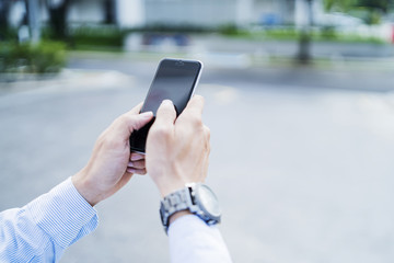 Man using mobile phone outdoors