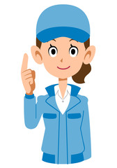 人差し指を立てて説明する青い作業着の女性
