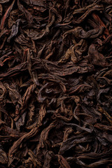 dried tea leaves close up. Black tea loose marco background