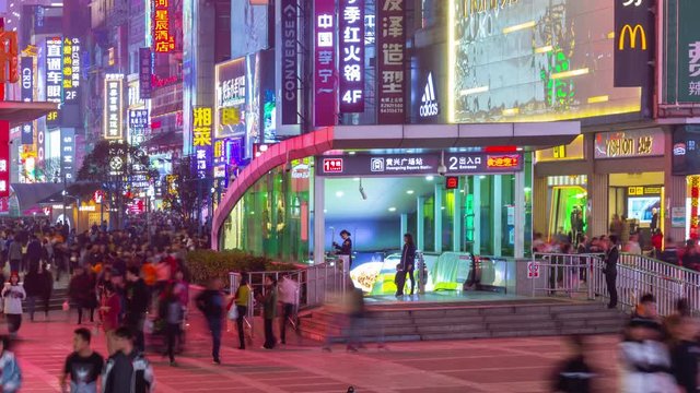 changsha city downtown night time crowded pedestrian street subway entrance panorama timelapse 4k china