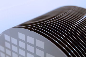 Close up of Silicon wafers grey color with chip cells prepared for production in a semiconductors manufacturing facility