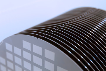 Close up of Silicon wafers grey color with chip cells prepared for production in a semiconductors...