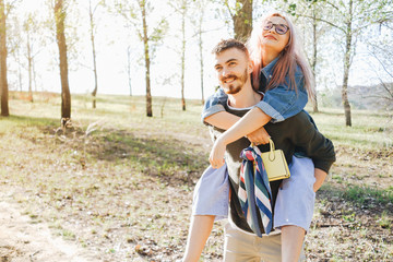 Young smiling couple enjoying in the park.