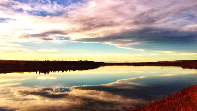 Reflection Of Clouds In Glenmore Reservoir