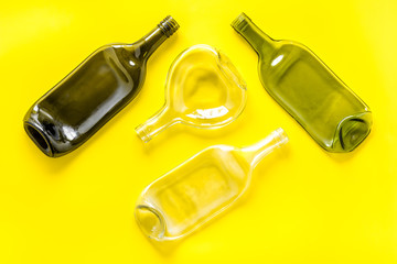 Pattern of bottles on yellow background top view