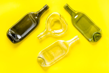 Fototapeta premium Pattern of bottles on yellow background top view